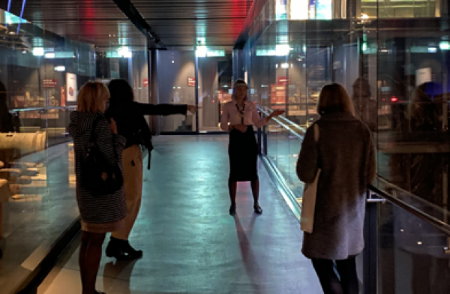 People on a guided tour inside the Mary Rose Museum
